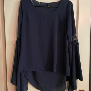 Navy top with bell sleeves and lace details